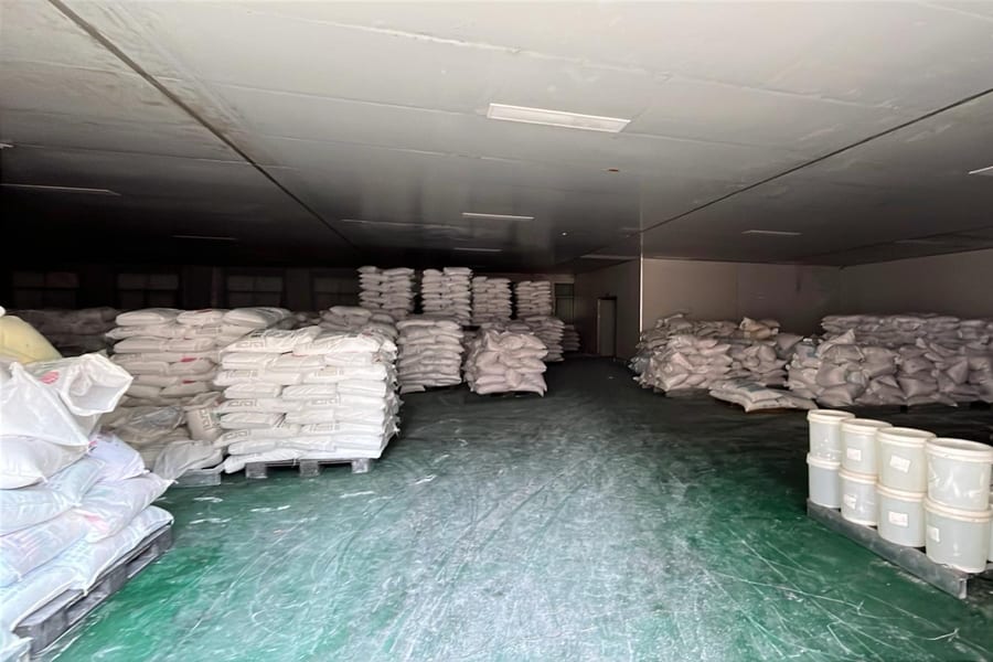 Raw material sacks stored in a factory warehouse in China